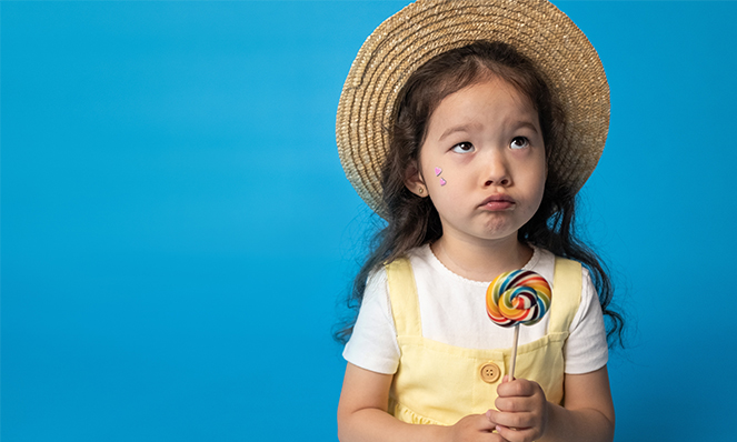 Little Girl with Lollipop Candy